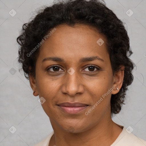 Joyful black adult female with short  brown hair and brown eyes