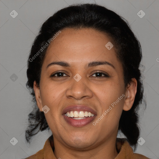 Joyful latino adult female with medium  brown hair and brown eyes