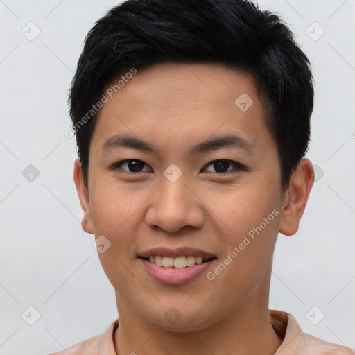 Joyful asian young-adult male with short  brown hair and brown eyes