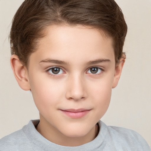 Joyful white child female with short  brown hair and brown eyes