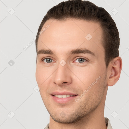 Joyful white young-adult male with short  brown hair and brown eyes