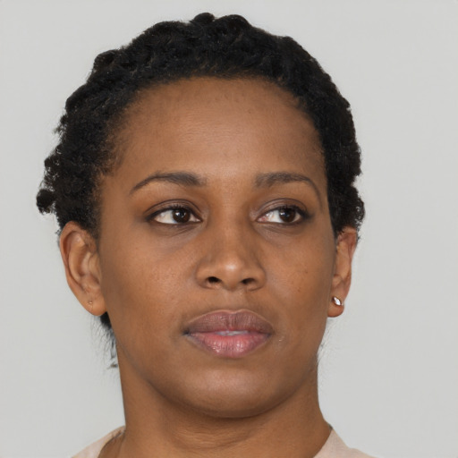 Neutral black young-adult female with short  brown hair and brown eyes