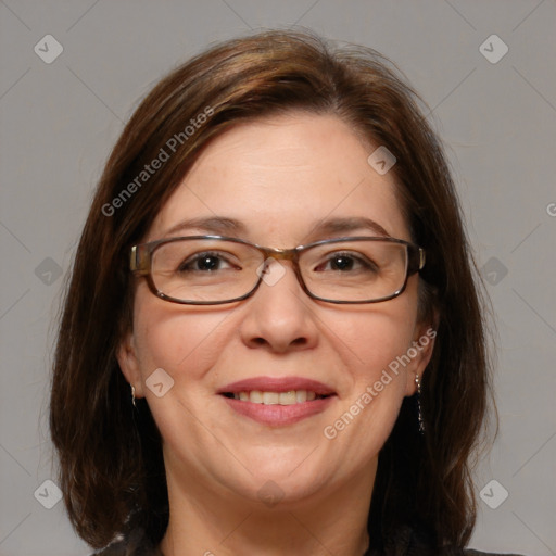 Joyful white adult female with medium  brown hair and blue eyes