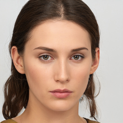 Neutral white young-adult female with medium  brown hair and brown eyes