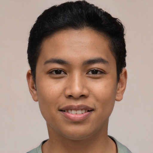 Joyful asian young-adult male with short  black hair and brown eyes