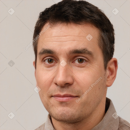 Joyful white adult male with short  brown hair and brown eyes