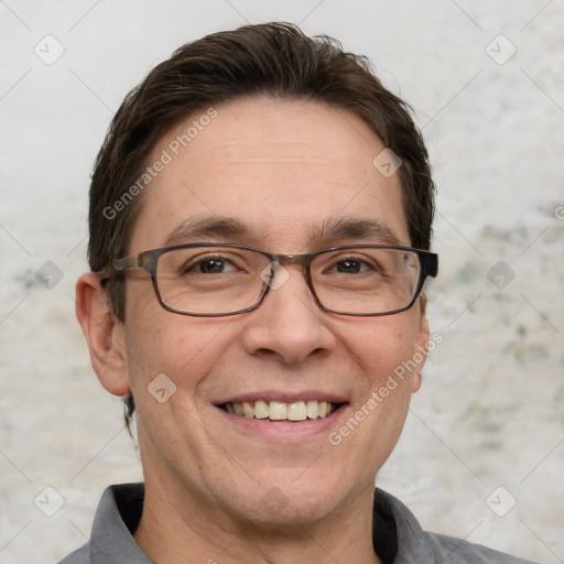 Joyful white adult male with short  brown hair and grey eyes