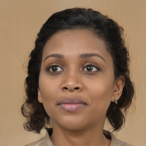 Joyful black young-adult female with medium  brown hair and brown eyes
