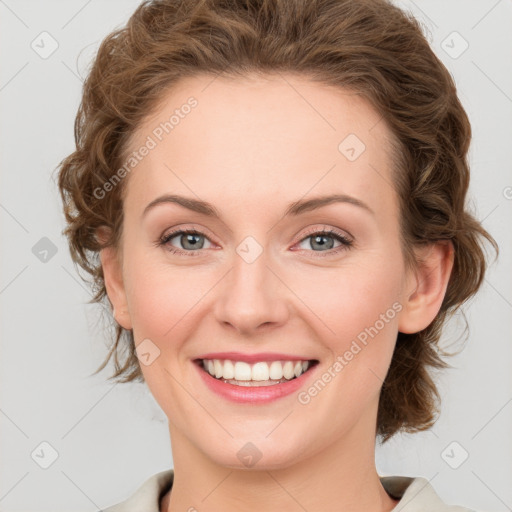 Joyful white young-adult female with medium  brown hair and green eyes