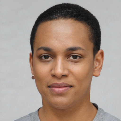 Joyful latino young-adult female with short  black hair and brown eyes