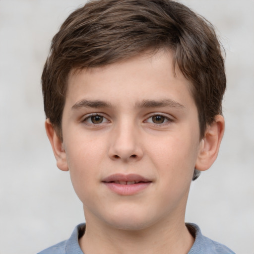 Joyful white child male with short  brown hair and brown eyes