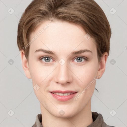 Joyful white young-adult female with short  brown hair and grey eyes