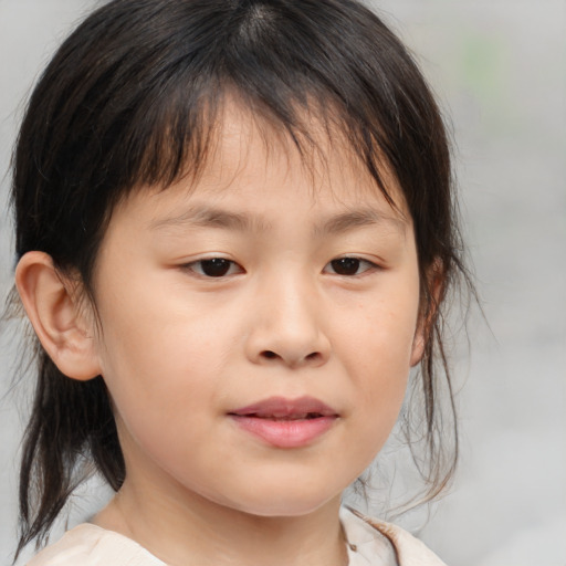 Joyful asian child female with medium  brown hair and brown eyes