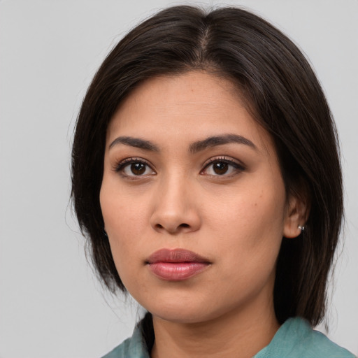 Neutral white young-adult female with medium  brown hair and brown eyes