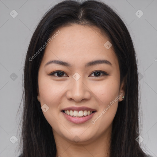 Joyful asian young-adult female with long  brown hair and brown eyes