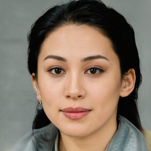 Joyful latino young-adult female with medium  black hair and brown eyes