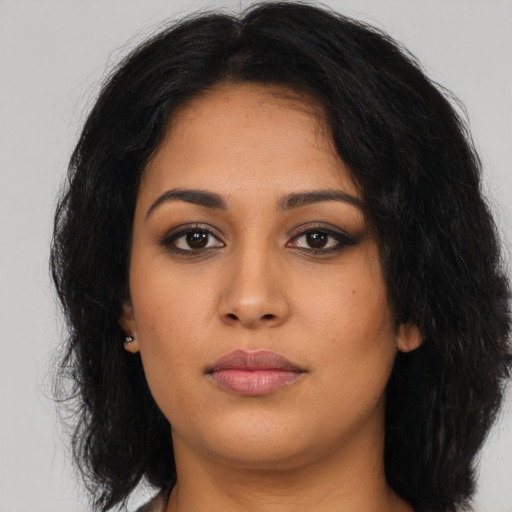 Neutral latino young-adult female with long  brown hair and brown eyes