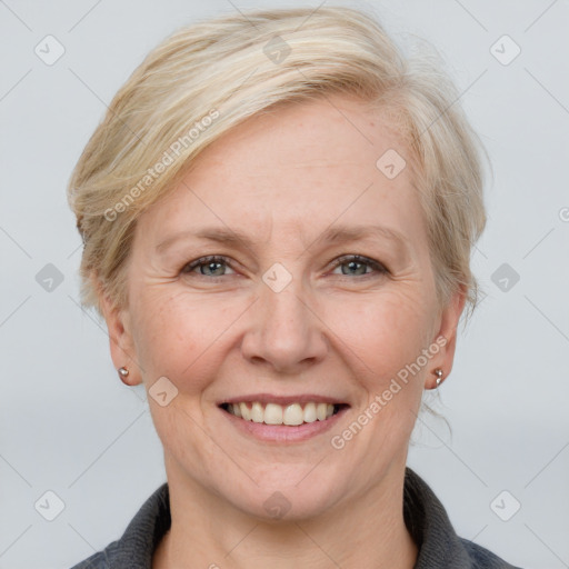 Joyful white adult female with medium  brown hair and grey eyes