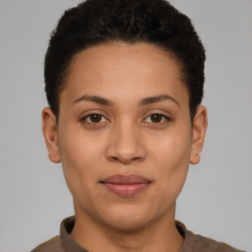 Joyful latino young-adult female with short  brown hair and brown eyes