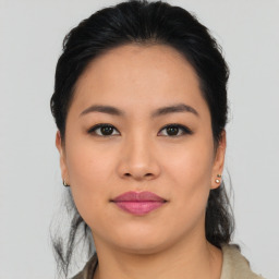 Joyful asian young-adult female with medium  black hair and brown eyes