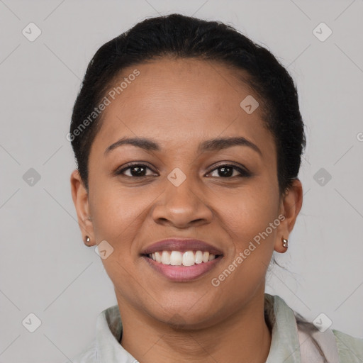 Joyful latino young-adult female with short  black hair and brown eyes