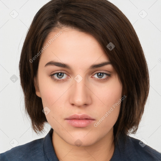 Neutral white young-adult female with medium  brown hair and brown eyes