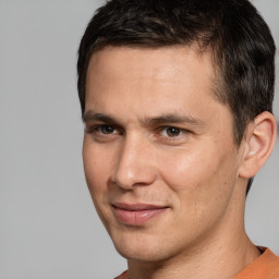 Joyful white adult male with short  brown hair and brown eyes