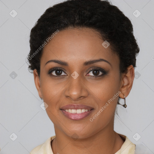 Joyful black young-adult female with short  brown hair and brown eyes