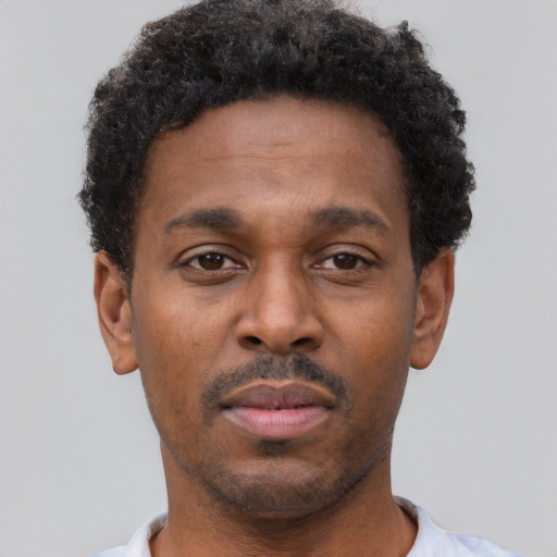 Neutral black young-adult male with short  brown hair and brown eyes