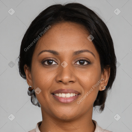 Joyful black young-adult female with medium  brown hair and brown eyes