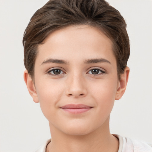 Joyful white child female with short  brown hair and brown eyes