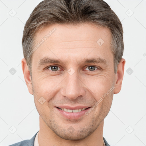 Joyful white adult male with short  brown hair and brown eyes