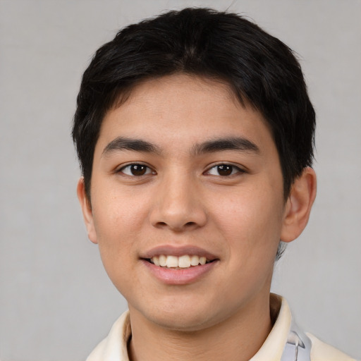 Joyful asian young-adult male with short  brown hair and brown eyes