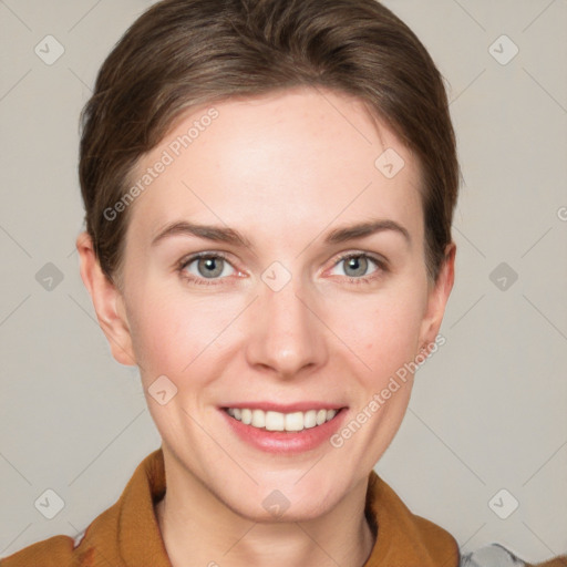 Joyful white young-adult female with short  brown hair and grey eyes