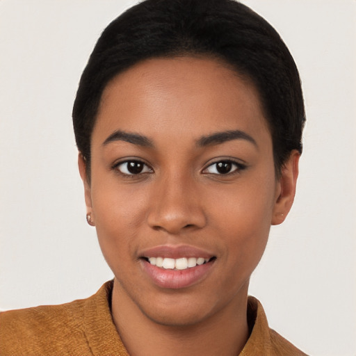 Joyful latino young-adult female with short  black hair and brown eyes