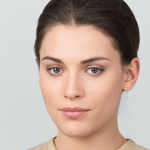 Neutral white young-adult female with short  brown hair and brown eyes