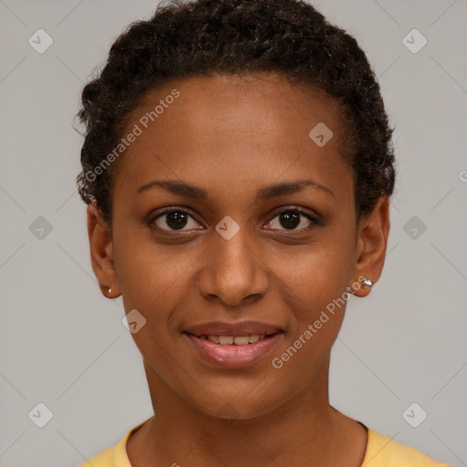 Joyful black young-adult female with short  brown hair and brown eyes