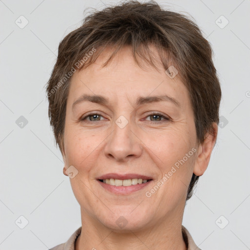 Joyful white adult female with short  brown hair and brown eyes