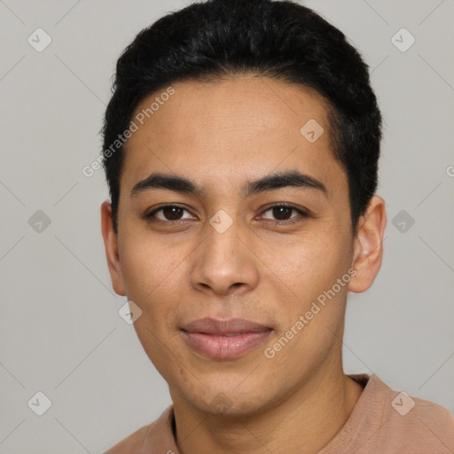 Joyful latino young-adult male with short  black hair and brown eyes