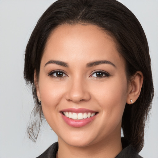 Joyful white young-adult female with medium  brown hair and brown eyes