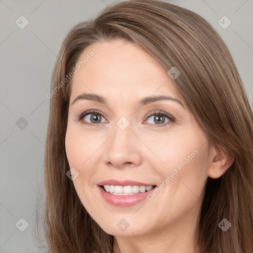 Joyful white young-adult female with long  brown hair and brown eyes