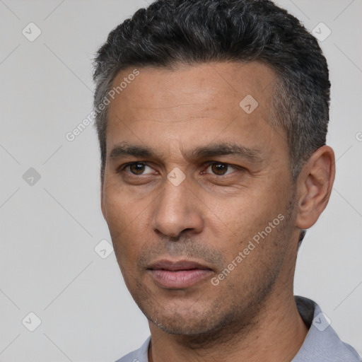 Neutral latino adult male with short  black hair and brown eyes