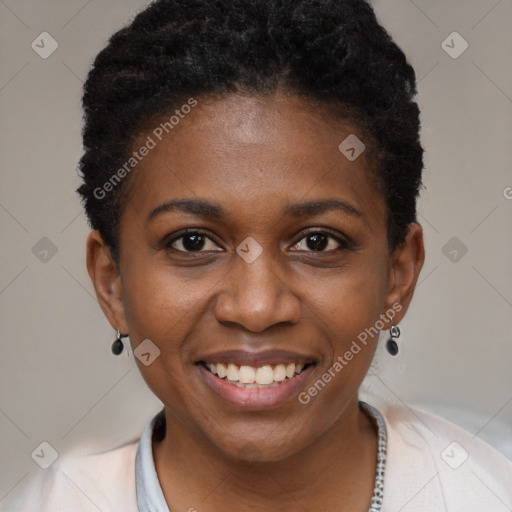 Joyful black young-adult female with short  black hair and brown eyes