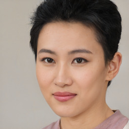 Joyful asian young-adult female with short  brown hair and brown eyes