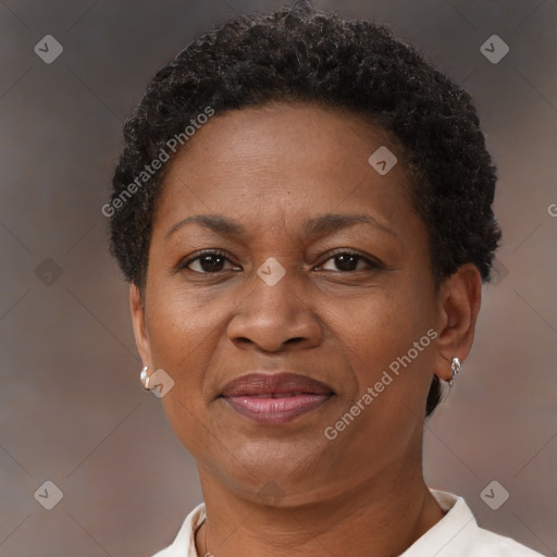 Joyful black adult female with short  brown hair and brown eyes