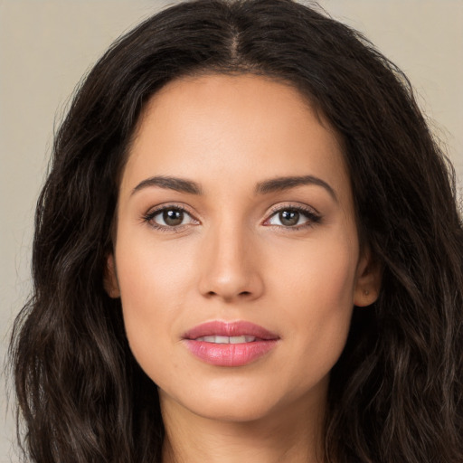 Joyful white young-adult female with long  brown hair and brown eyes