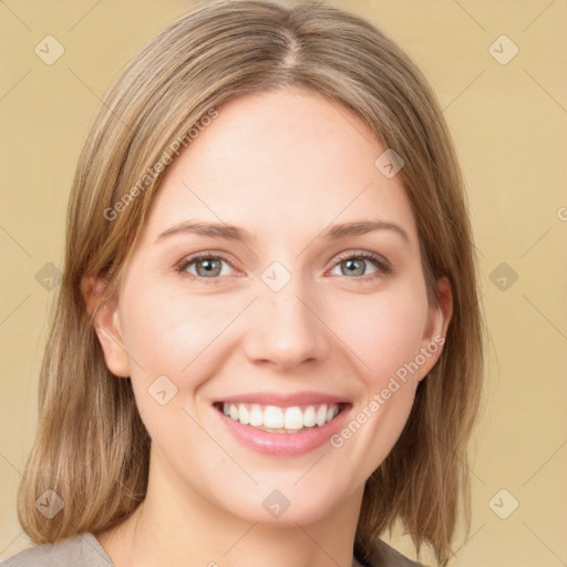 Joyful white young-adult female with medium  brown hair and green eyes