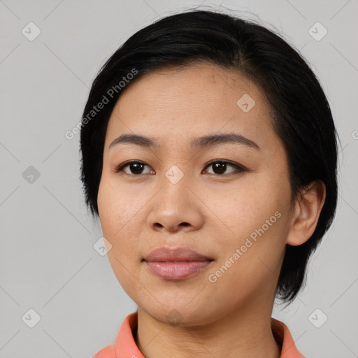 Joyful asian young-adult female with medium  black hair and brown eyes