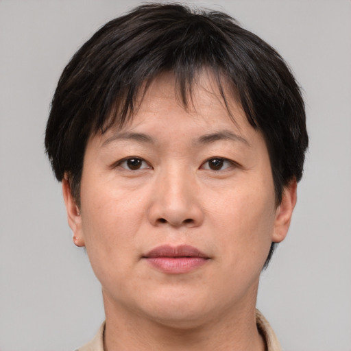 Neutral asian adult female with short  brown hair and brown eyes