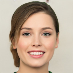 Joyful white young-adult female with medium  brown hair and green eyes